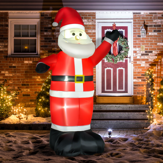 Inflatable Santa Claus figure in front of a house with Christmas decorations.