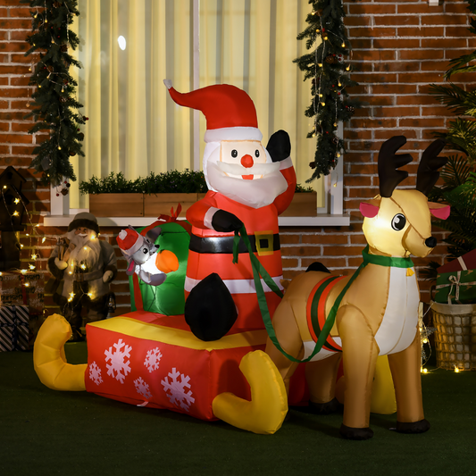 Inflatable Santa Claus with reindeer and sleigh in a festive indoor setting.