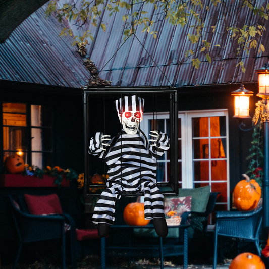 Sound-Activated Skeleton Prisoner with Evil Laugh & Lights – White/Black