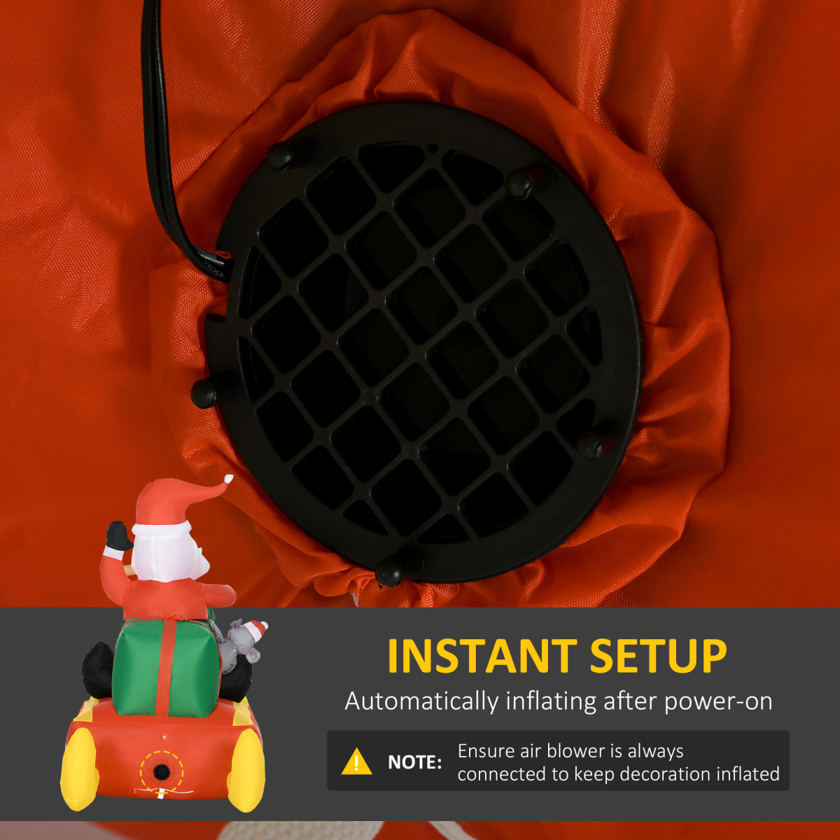 Black air blower with red fabric and Santa Claus decoration on a gray background