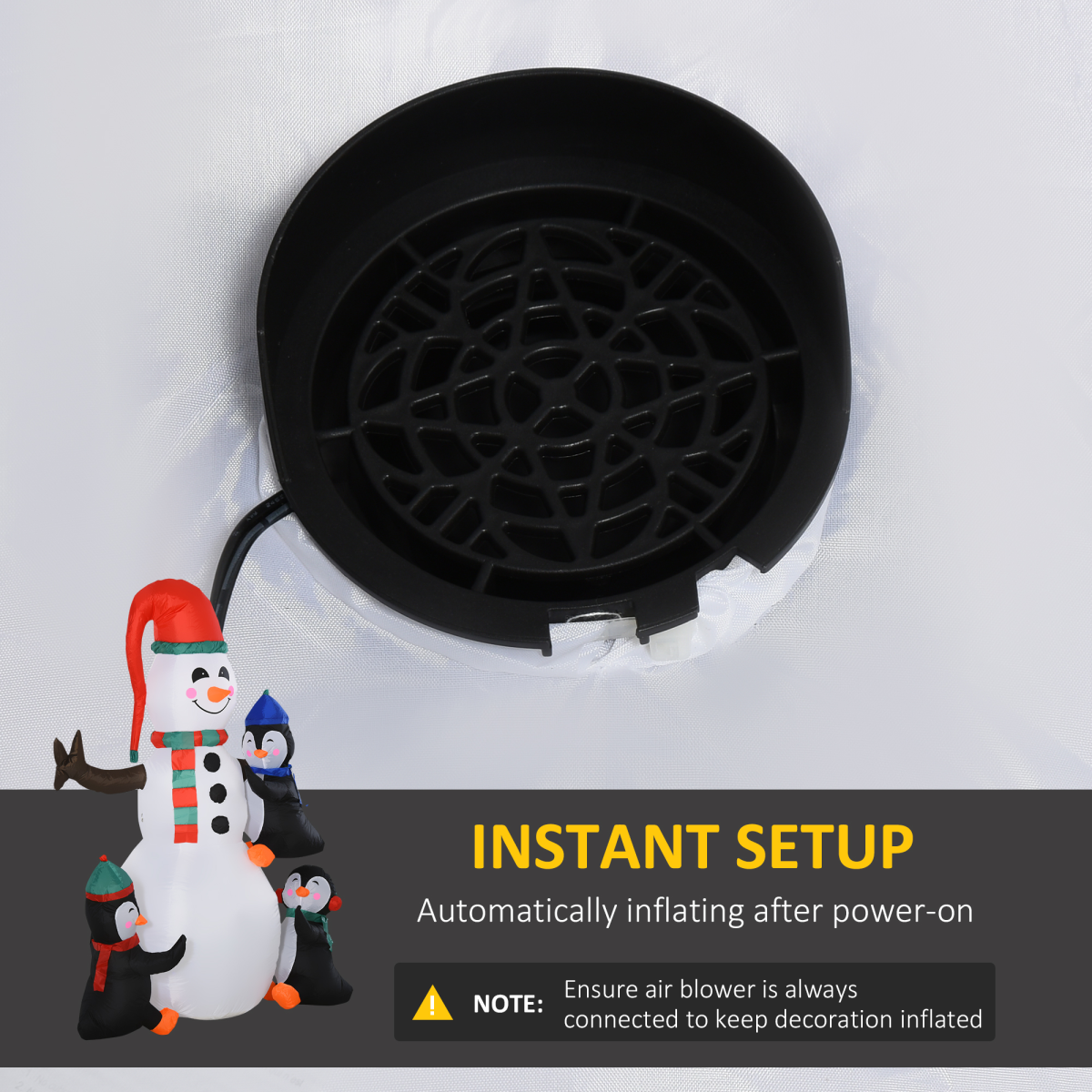 Black air blower with snowman and penguin decorations on a white background