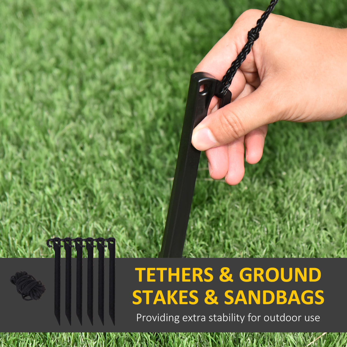 Hand holding a black stake against a grass background with text about tethers, ground stakes, and sandbags.