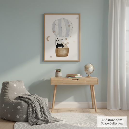Children's room with a gray bean bag chair, wooden table, and framed artwork on a light blue wall.